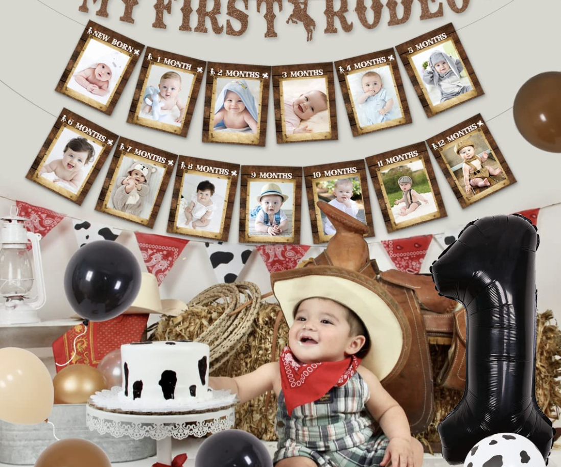 Child in a cowboy hat and bandana sits in front of a banner made from photo frames.